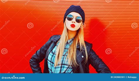 Portrait Of Stylish Beautiful Blonde Woman Blowing Her Red Lips Sending