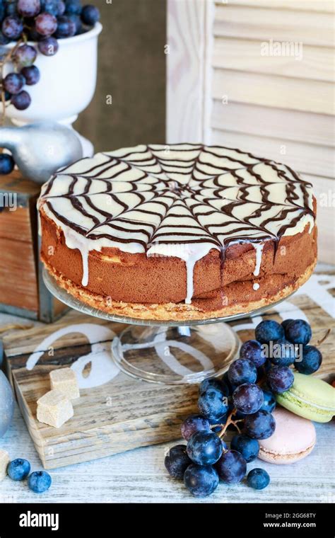 Halloween Chocolate Spider Web Cake And Various Fruits Around Party