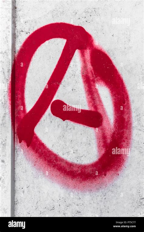 Anarchy graffiti. Anarchy symbol sprayed on the wall. Rejection of the hierarchy Stock Photo - Alamy