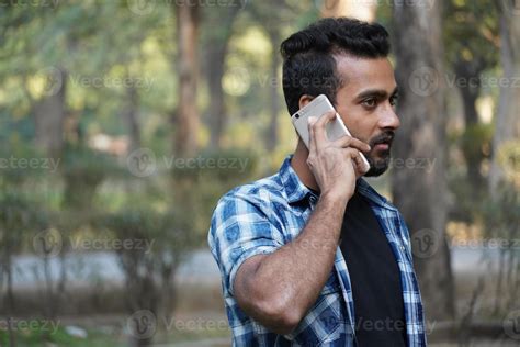 young man indian student talking on call portrait 6859224 Stock Photo
