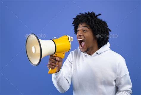 Cool News Agitated African American Teen Guy Screaming Into Megaphone