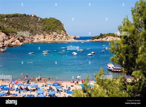 Tourists on the beach of Puerto de San Miguel, Ibiza, Spain, elevated ...