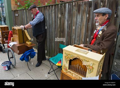 Organ Grinders In Period Costume Playing Street Organs At The Victorian