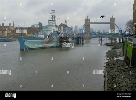 HMS Belfast On The River Thames With Tower Bridge In The Background