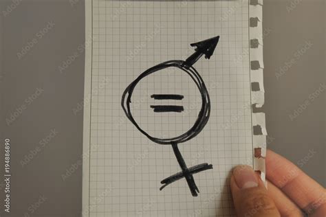 Equals Sign And A Male Symbol Drawn On A Piece Of Paper Depicting The Women Sexual Equality