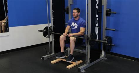 Smith Machine Seated Calf Raise Video Exercise Guide And Tips