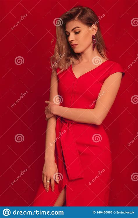 Blonde Woman Posing In Red Dress On Red Background Stock Image Image Of Motion Dress