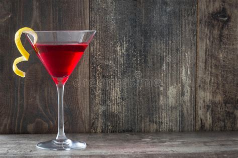 Two Cosmopolitan Cocktails In Traditional Martini Glasses With View To