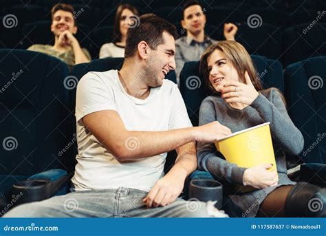 Couple Eats Popcorn While Watching Movie In Cinema Stock Image Image