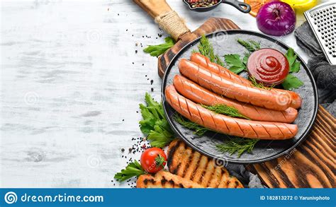 Boiled Sausage With Ketchup On A Black Plate Stock Photo Image Of