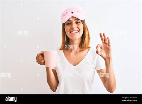 Beautiful Redhead Woman Wearing Sleeping Mask Drinking A Cup Of Coffee