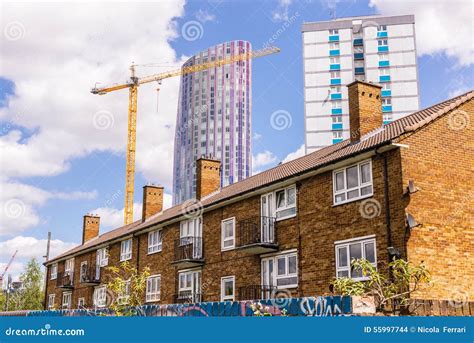 Small Block Of Flats With Council House And Modern Skyscraper Stock