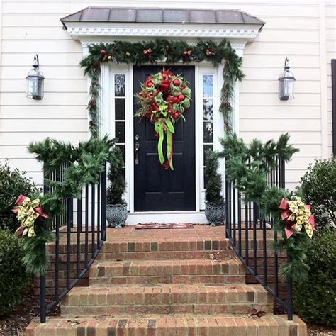 Outdoor Christmas Decorating With Green Garlands And Winter Holiday Wreaths