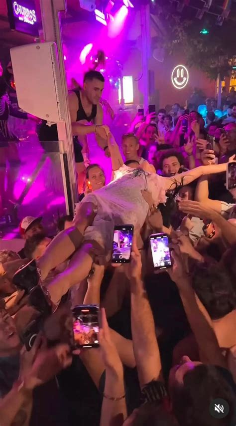 Married Katy Perry kisses a fan and dishes out shots during wild night