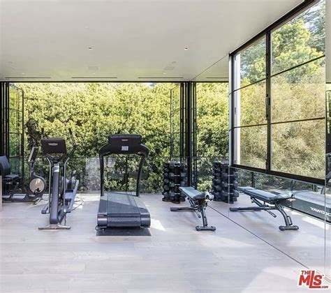 Gym Exercise Room With Full Length Windowsgarage Doors In 2021