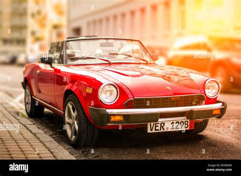 Retro Fiat Sports Car Standing By The Side Of The Street On A Sunny And