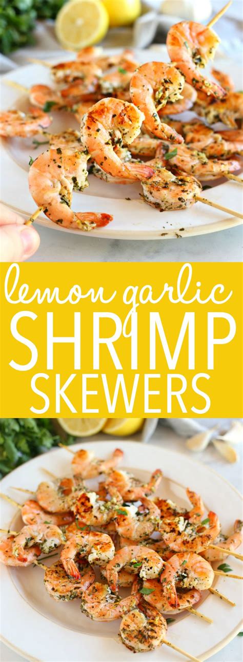 grilled lemon garlic shrimp skewers on a white plate with text overlay