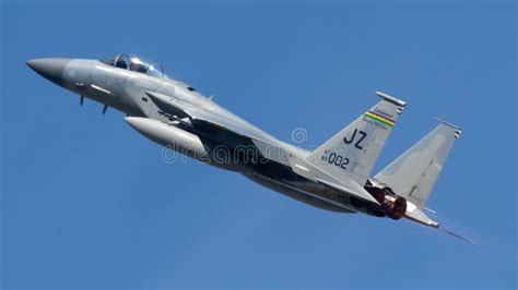 Fighter Jet Soaring Through A Bright Blue Sky Editorial Stock Image