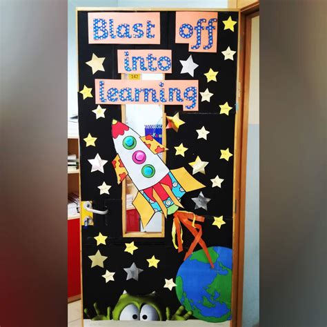 A Bulletin Board With The Words Blast Off Into Learning Written On It