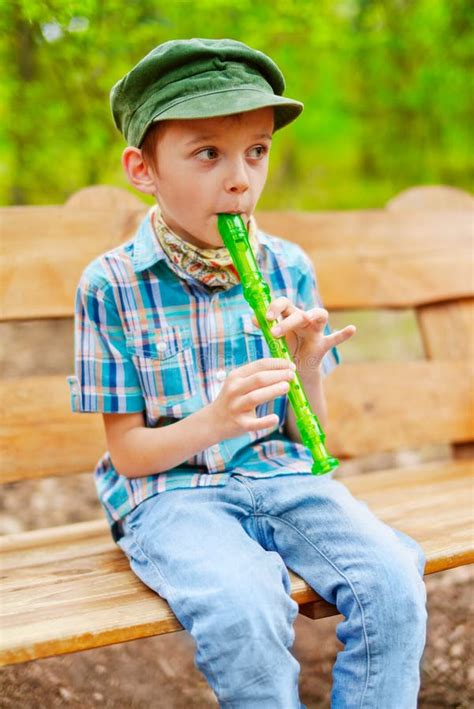 Young kid playing recorder stock image. Image of flutist - 31413257