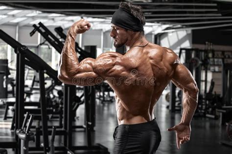 Muscular Man Showing Biceps And Back Muscles Strong Male Naked Torso Stock Image Image Of