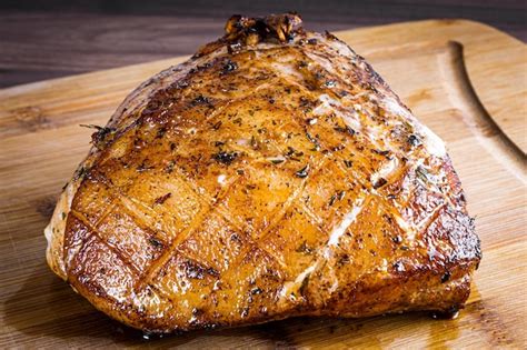 Premium Photo Roasted Pork Steak On A Wooden Board