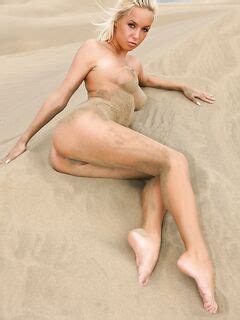 Fine Looking Nude Blonde Natali Blond With Sexy Legs And Tight Ass Poses In Sand