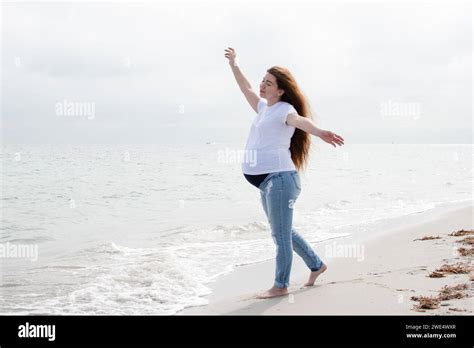 Pregnant Woman Enjoying The Ocean Pregnant Woman On The Beach Happy Healthy Pregnancy