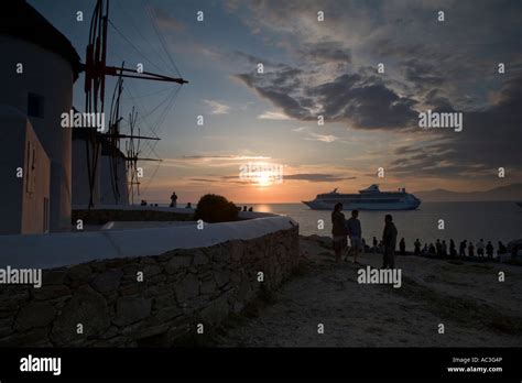 Windmills of Mykonos at sunset Stock Photo - Alamy