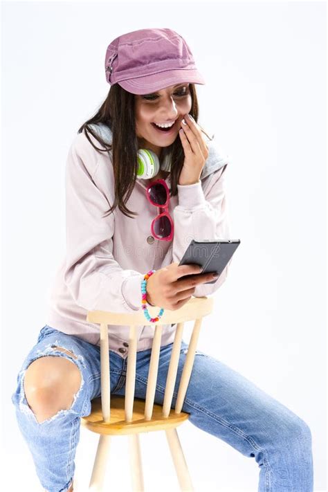 Shy Caucasian Brunette Girl With Smartphone And A Pair Of Big He Stock Image Image Of Denim