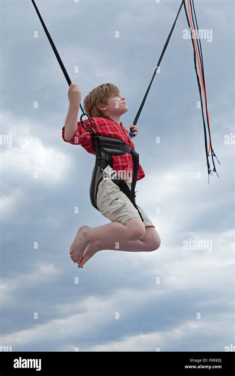 Young Boy On Bungee Trampoline Warnemuende Rostock Mecklenburg West