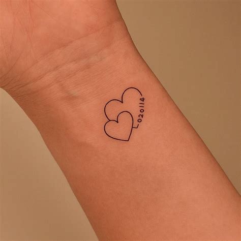 Minimalistic Hearts And Date Tattoo Located On The Amor Tattoo Tattoo