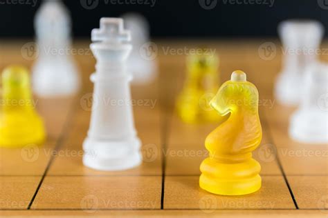 Chess glass on a wood chessboard 9322160 Stock Photo at Vecteezy