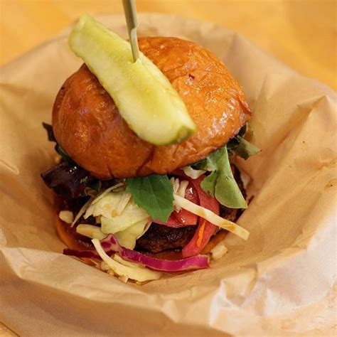 A Pacman Burger With Pork Belly Hoisin Sesame Teriyaki Slaw And