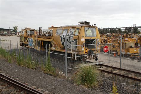 Ballast tamper at the John Holland track machine compound at Spotswood - Wongm's Rail Gallery