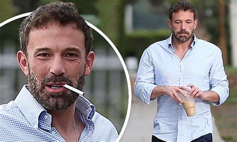 Ben Affleck enjoys a cigarette and iced coffee during a morning stroll ...