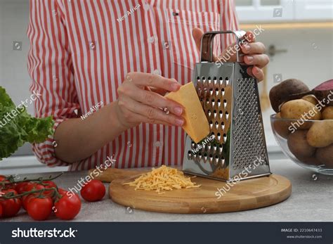 Woman Grating Cheese Kitchen Table Closeup Stock Photo 2210647433