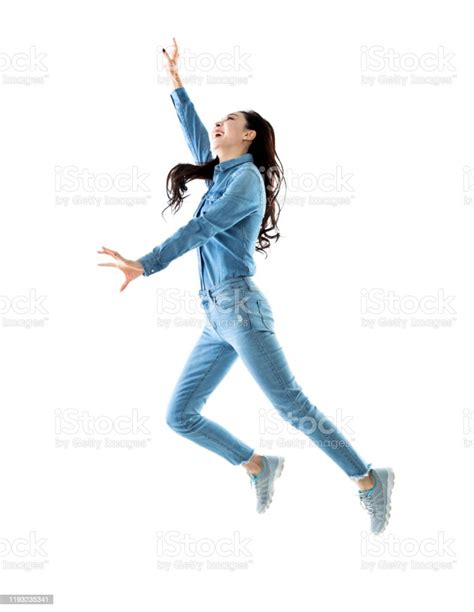 Excited Woman Jumping On White Background Stock Photo Download Image