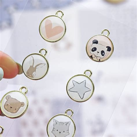 Set de charms metálicos Pequeño Panda 8 ud Alúa Cid Scrapbooking