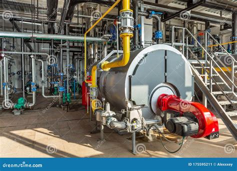 Interior Of An Industrial Boiler Room With Boilers Many Pipes Valves