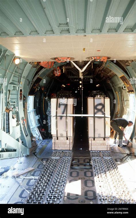 An interior view of a C-141B Starlifter aircraft with boxes containing ...