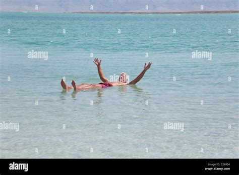 Senior Man Happy Float Effortlessly On The Dead Sea Water Stock Photo