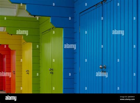 A Close Up View Of Colorful Wooden Beach Huts On The Beach Of