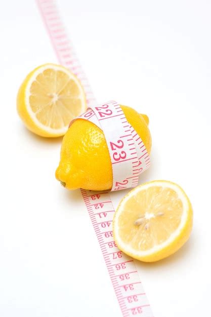 Premium Photo Lemon And Tape Measure Isolated On White Background