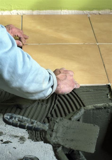 Laying Tiles On The Floor Builder Stock Image Image Of Real