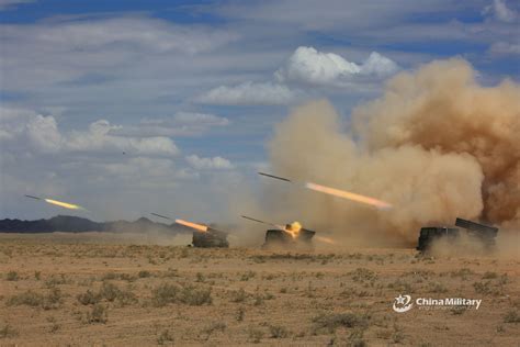 Vehicle-mounted 122mm rocket launcher systems attached to a combined ...