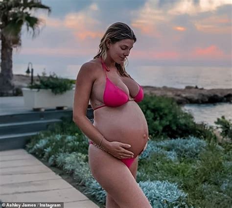 Pregnant Ashley James Cradles Her Baby Bump In A Pink Bikini In