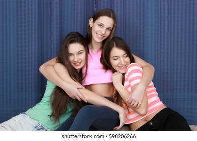 Three Happy Friends Talking Drinking Coffee Stock Photo