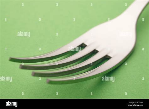 Fork Detail Over A Green Background Cutlery Horizontal Stock Photo