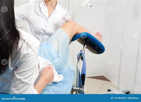 Cropped Panorama Of Gynecologist Examining A Patient Who Is Sitting In